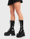 THESE BOOTS ARE MADE FOR WALKING
  
  Get Paid Chunky Platform Calf Boots in Black patent. These vegan western Boots feature a black lace up boot with silver round eyelets , very classy. Made with eco-friendly materials and 100% cruelty-free, these boots are as ethical as they are edgy!
  
  
  - Chunky Platform
  - Calf length
  - Lace up
  - Silver round eyelets
  - Rounded toe 
  - 100% vegan 
  
  SKU: LMF 3605 - BlackPAT