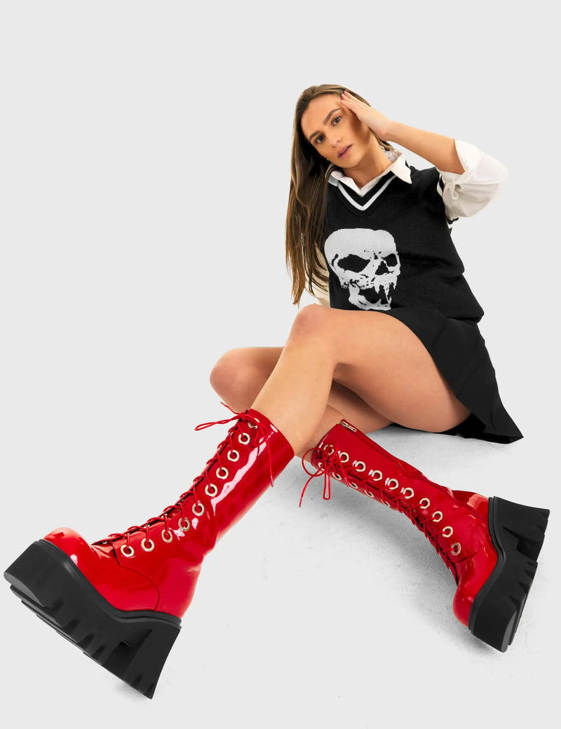THESE BOOTS ARE MADE FOR WALKING
  
  Get Paid Chunky Platform Calf Boots in Red patent. These vegan western Boots feature a black lace up boot with silver round eyelets , very classy. Made with eco-friendly materials and 100% cruelty-free, these boots are as ethical as they are edgy!
  
  
  - Chunky Platform
  - Calf length
  - Lace up
  - Silver round eyelets
  - Rounded toe 
  - 100% vegan 
  
  SKU: LMF 3605 - RedPAT