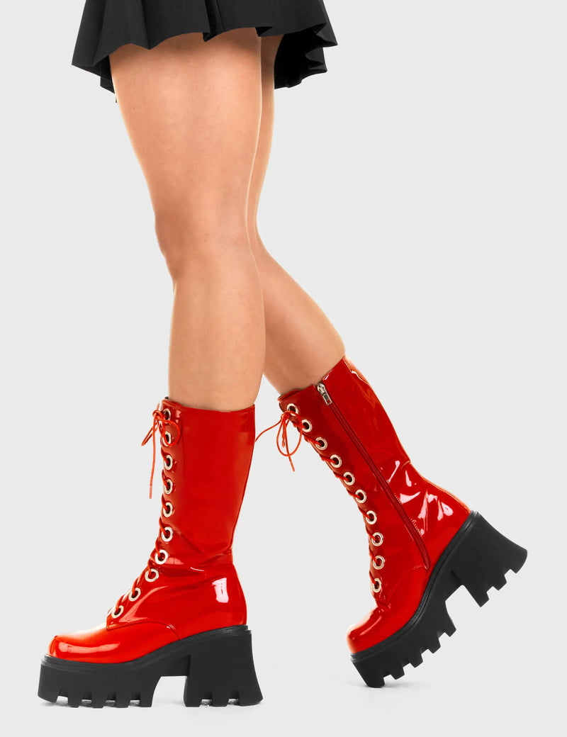 THESE BOOTS ARE MADE FOR WALKING
  
  Get Paid Chunky Platform Calf Boots in Red patent. These vegan western Boots feature a black lace up boot with silver round eyelets , very classy. Made with eco-friendly materials and 100% cruelty-free, these boots are as ethical as they are edgy!
  
  
  - Chunky Platform
  - Calf length
  - Lace up
  - Silver round eyelets
  - Rounded toe 
  - 100% vegan 
  
  SKU: LMF 3605 - RedPAT