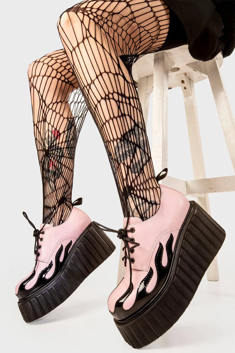 Blaze Runner
  
  Girls On Tour Chunky Platform Creeper Shoes in Pink. These pink creeper shoes feature a patent black flame across the side of the shoe, stepping on flames and setting hot trends. Made with eco-friendly materials and 100% cruelty-free, these platform boots are as ethical as they are HOT!
  
  - Platform Height
  - Black Laces with black eyelets
  - Patent black flame 
  - Chunky creeper wedge sole
  - Round Toe 
  - 100% vegan 
  
  SKU: LMF 2222 - Pink/Flame