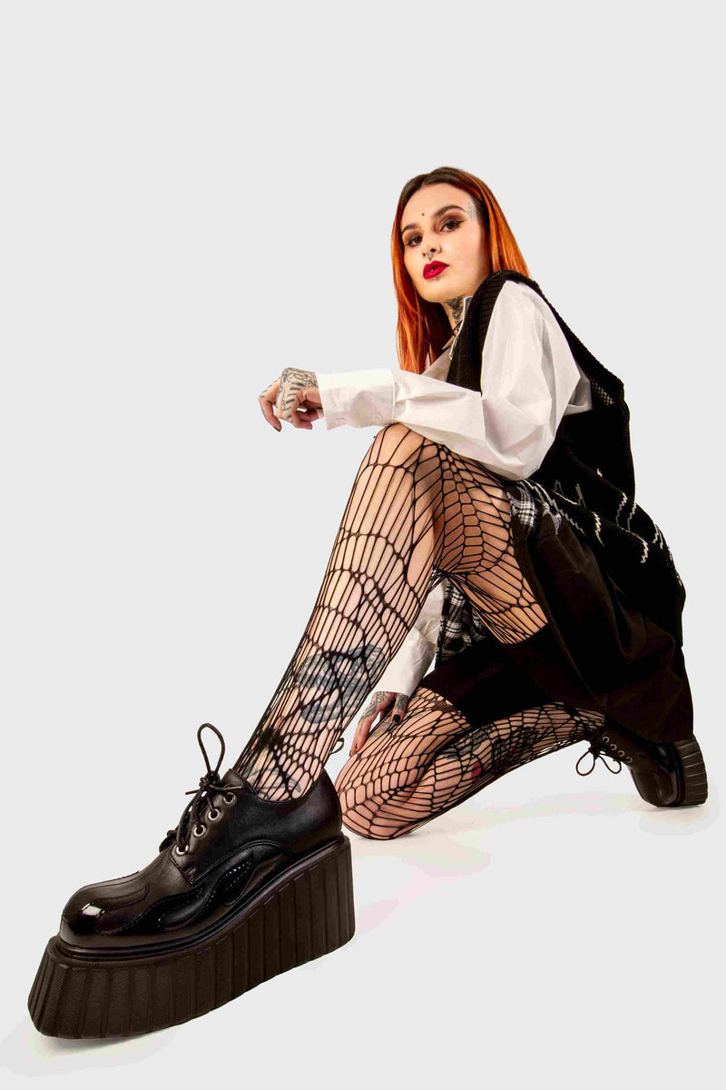 Blaze Runner
  
  Girls On Tour Chunky Platform Creeper Shoes in Black. These black creeper shoes feature a patent black flame across the side of the shoe, stepping on flames and setting hot trends. Made with eco-friendly materials and 100% cruelty-free, these platform boots are as ethical as they are HOT!
  
  - Platform Height
  - Black Laces with black eyelets
  - Patent black flame 
  - Chunky creeper wedge sole
  - Round Toe 
  - 100% vegan 
  
  SKU: LMF 2222 - Black/Flame