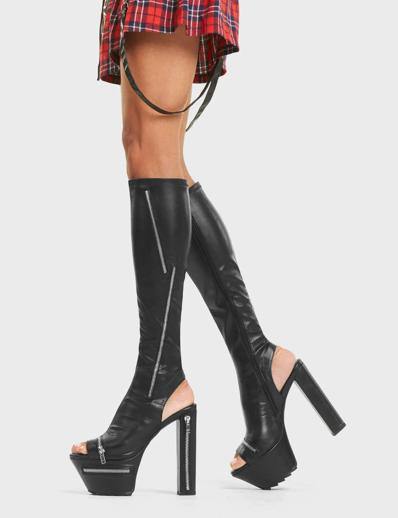 VIGILANTE
 
 Give It Up Platform Knee High Boots in Black faux leather. These boots feature an edgy zip design around and across the boot, with a block heel that also features a zip design. Also features a open toe and heel aesthetic. On our platform sole, the perfect way to make everyone stop and stare. Made with 100% vegan materials 
 
 - Platform Height: 5.5 CM
 - Heel Height: 14 CM
 - Silver Zip design
 - High Heel
 - Cut out design
 - Platform sole
 - Open toe.
 - 100% vegan
 
 SKU: LMF 4426 - BlackPU