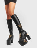 DELICATE LOVER
  
  Glass Heart Chunky Platform Knee High Boots in Black and leopard faux leather. These vegan boots feature faux suede leopard print hearts and a Chunky Platform sole, perfect for adding height and the wow factor to any outfit. Made with eco-friendly materials and 100% cruelty-free!
  
  - Platform Height: 
  - Heel Height:
  - Knee high length
  - Leopard print hearts
  - Black Zipper
  - Chunky Platform Sole
  - Round Toe
  - 100% Vegan
  
  SKU: LMF 5114 - BlackPU/Leo