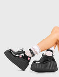 HIGH MOOD Good Day Chunky Platform Creeper Shoes in Black Patent. These vegan shoes feature pink hearts and a adjustable strap, very classy. Made with eco-friendly materials and 100% cruelty-free, these boots are as ethical as they are edgy! - Chunky Platform - Ankle length - Adjustable straps - Silver Buckle - Pink Heart feature - Rounded toe - 100% vegan SKU: LMF 3620 - BlackPAT/PinkHeart