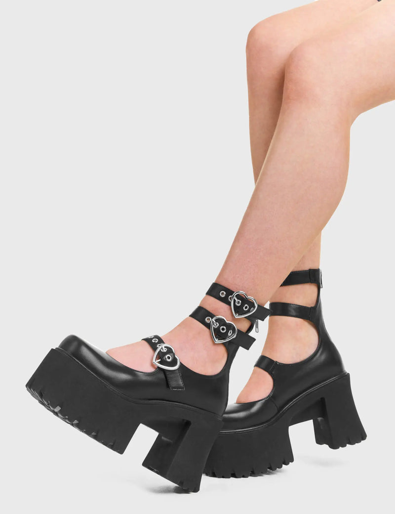 GO AWAY Good Riddance Chunky Platform Ankle Boots in Black faux leather. These vegan Boots feature a minimalist design with three adjustable straps, and heart shaped silver buckles, alongside silver eyelets. Very chic and made with eco-friendly materials and 100% cruelty-free, these boots are as ethical as they are cute!- Platformed- Ankle length- Three adjustable straps - Silver heart shaped buckles- Chunky platform sole- Rounded toe - 100% vegan SKU: LMF 3947 - BlackPU"
