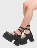 GO AWAY Good Riddance Chunky Platform Ankle Boots in Black faux leather. These vegan Boots feature a minimalist design with three adjustable straps, and heart shaped silver buckles, alongside silver eyelets. Very chic and made with eco-friendly materials and 100% cruelty-free, these boots are as ethical as they are cute!- Platformed- Ankle length- Three adjustable straps - Silver heart shaped buckles- Chunky platform sole- Rounded toe - 100% vegan SKU: LMF 3947 - BlackPU"