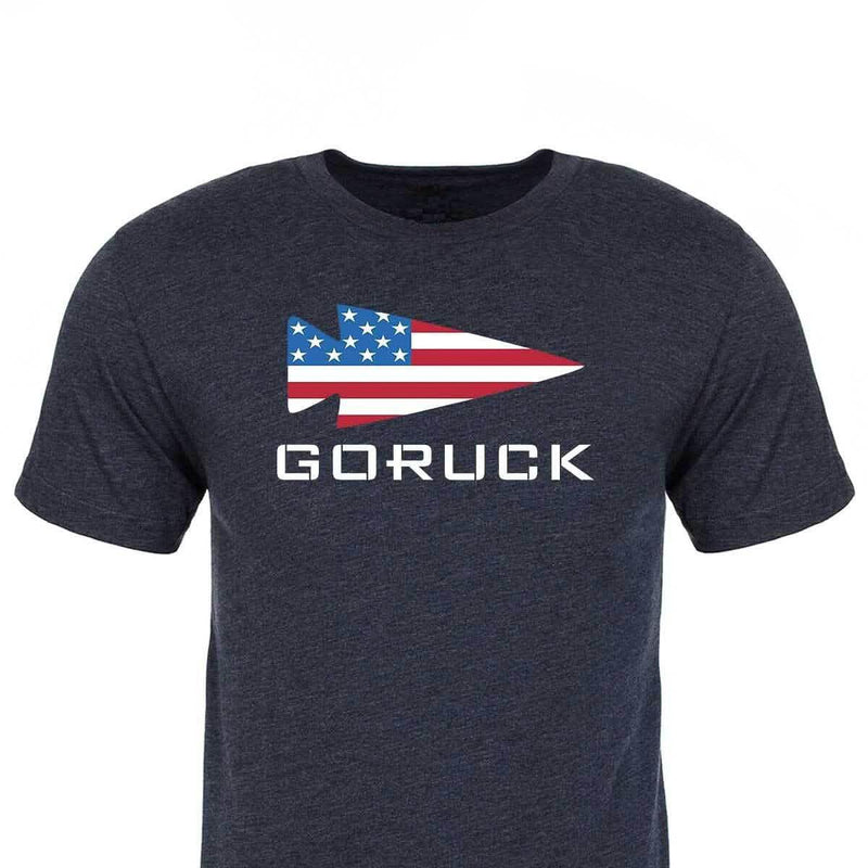 GORUCK navy t-shirt with American flag arrowhead logo and bold GORUCK text on chest