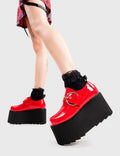Step Out in Fashion
  
  Grounded Chunky Platform Shoes in Red Patent. These flatform shoes feature a large strap with a large silver 'O' ring buckle. Made with eco-friendly materials and 100% cruelty-free, these platform boots are as ethical as they are Edgy
  
  - Platform Height
  - Large strap
  - Silver buckle and eyelets
  - Flatform Sole
  - Shark's Teeth Grip
  - 100% vegan 
  
  SKU: LMF 3133 - RedPAT