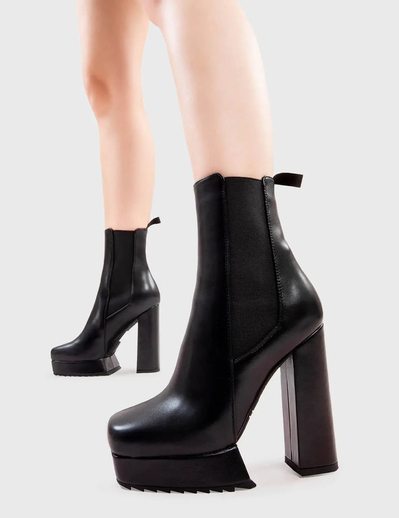 Better Than Basic
  
  Hackers Platform Ankle Boots in Black faux leather. These platform boots feature a minimalist design with a stretchy gusset and pull tag, the perfect boots with any outfit. Made with eco-friendly materials and 100% cruelty-free, these platform boots are as ethical as they are Iconic!
  
  - Platform Height
  - Heel Height
  - Gusset and Pull Tag 
  - Ankle length
  - Shark's teeth grip
  - Platform sole
  - 100% vegan 
  
  SKU: LMF 2835 - BlackPU
