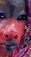 Meet Hariel! I started making art soon after seeing authentic African artwork at the Smithsonian Museum of African Art. I was in total awe. Jafari was inspired by my visit there.   Hariel has a two tone red and dark metallic copper complexion. She  is 6" x 4" and weighs 5 ozs. Hariel has over 4 feet of coiled 16 gauge wire hair and countless red mini beads..