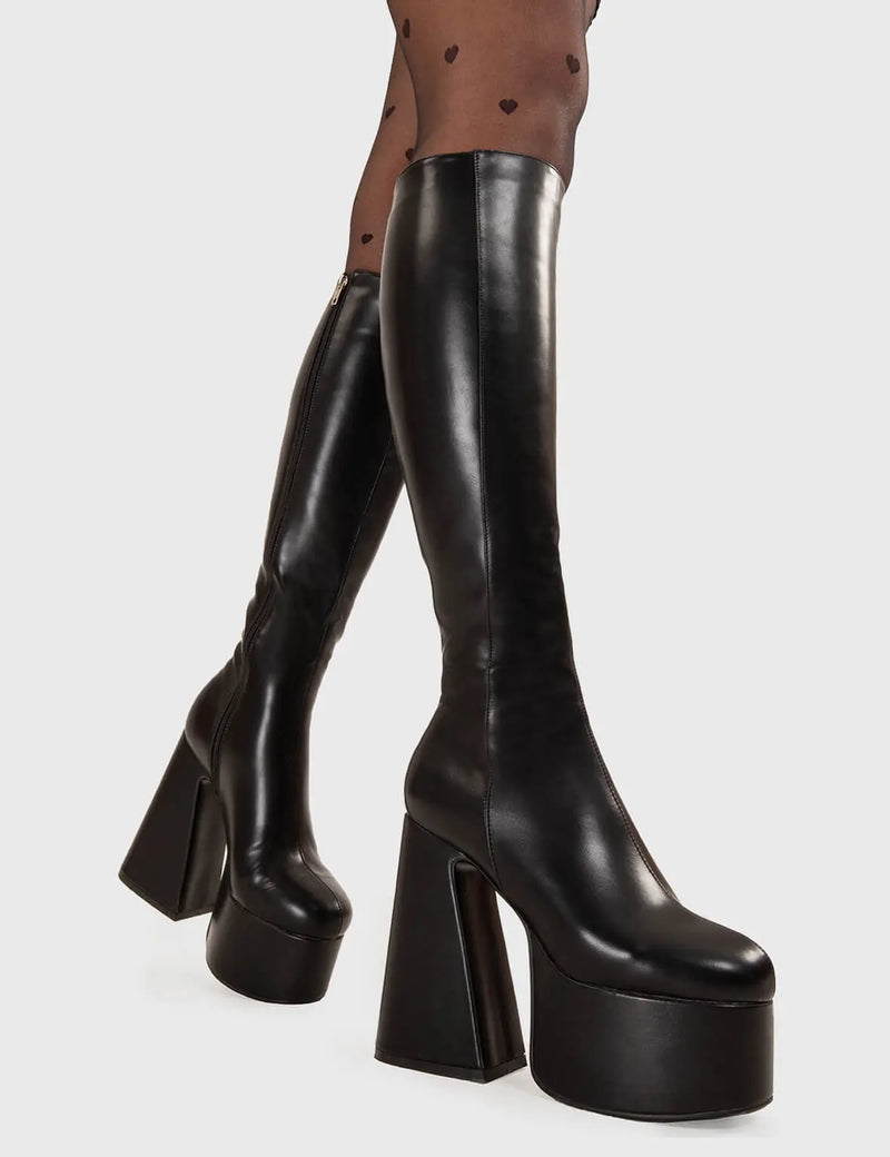 NICE AND SMOOTH
  
  Hate You Platform Knee High Boots in Black faux leather. These platform boots feature a minimalist look with a Flared heel, keeping it nice and classy. Made with eco-friendly materials and 100% cruelty-free, these platform boots are as ethical as they are chic.
  
  - Platform Height
  - Knee high 
  - Flared heel
  - High Heel
  - 100% vegan 
  
  SKU: LMF 3355 - BlackPU