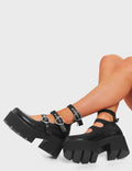 STAY PULLING
 
 Heart Strings Mary Jane Shoes, in Black Faux Leather. These vegan shoes feature three adjustable straps with Heart shaped silver buckles and eylets. All on a chunky platform sole with rubber grip, very classy. Made with eco-friendly materials and 100% cruelty-free, these boots are as ethical as they are edgy!
 
  
 - Chunky Platform
 - Ankle length
 -Three adjustable straps
 - Rubber teeth grip
 - Heart shaped silver buckle
 - Rounded toe 
 - 100% vegan 
 
 SKU: LMF 3905 - BlackPU