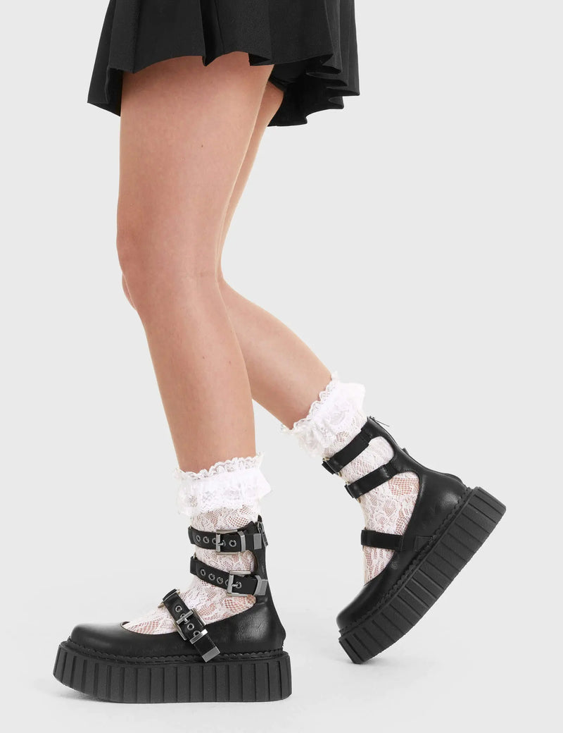 Flirty Flats
  
  Hologram Chunky Platform Creeper Boots in Black faux leather. These black Creeper boots feature three adjustable black straps with heart shaped buckles in the center on our chunky platform sole,make a statment with each flirty step. Made with eco-friendly materials and 100% cruelty-free.
  
  - Platform Height: 2.2 inch
  - Black strap silver eyelets
  - Black zip
  - Square shaped buckles
  - Chunky creeper sole
  - Round Toe 
  - 100% vegan 
  
  SKU: LMF 2200 - BlackPU