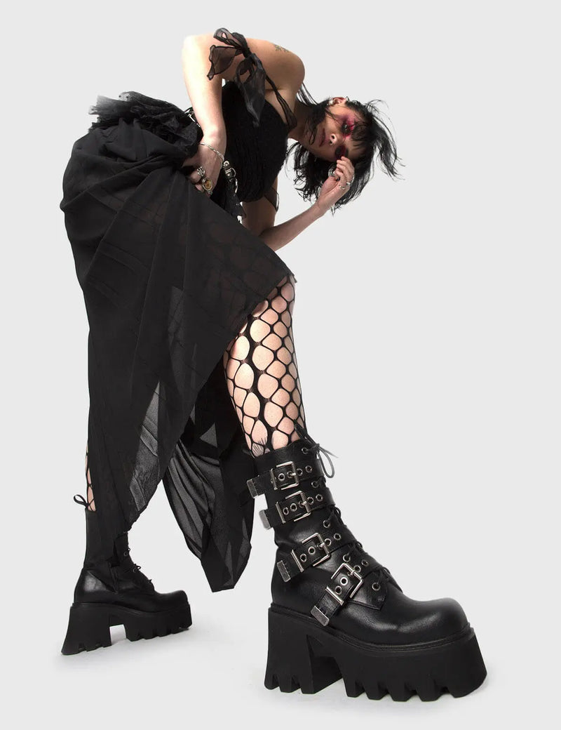 MAKE YOUR STATEMENT
  
  Hysteria Chunky Platform Ankle Boots in Black faux leather. These Platform Ankle Boots feature Silver buckles on a Chunky and comfortable Platform sole, making them the perfect choise to dress up any outfit! Made with eco-friendly materials and 100% cruelty-free.
  
  
  - Platform Height: 3.3 inch
  - High ankle height
  - Square buckles and silver eyelets
  - Chunky Platform sole
  - Lace up
  - Black zipper
  - Square toe 
  - 100% vegan 
  
  SKU: LMF 1091 - BlackPU