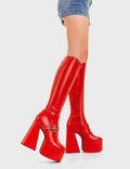 KEEPING IN CUTE
  
  I'm Your Star Platform Knee High Boots in Red faux leather. These platform boots feature a minimalist look with a silver star buckle. Made with eco-friendly materials and 100% cruelty-free, these platform boots are as ethical as they are chic.
  
  - Platform Height
  - Knee high 
  - Silver star buckle
  - Flared heel
  - High Heel
  - 100% vegan 
  
  SKU: LMF 3359 - RedPU