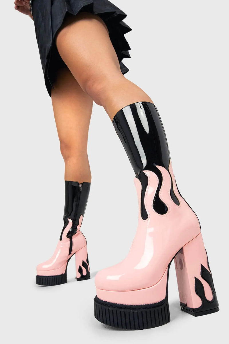 SIZZLING STOMPERS
  
  Ignite Platform Calf Boots in Black Patent. These vegan Platform Boots feature a pink patent flame sole with a black Patent flame on the heel igniting your outfit. Made with eco-friendly materials and 100% cruelty-free, these Boots are as ethical as they are HOT!
  
  - Platform Height: 2 inch
  - Heel Height: 5.5 inch
  - Patent pink flame sole
  - Patent black flame on heel 
  - Platform creeper sole
  - Black Zipper
  - Round toe 
  - 100% vegan 
  
  SKU: LMF 1576 - Black/Pink