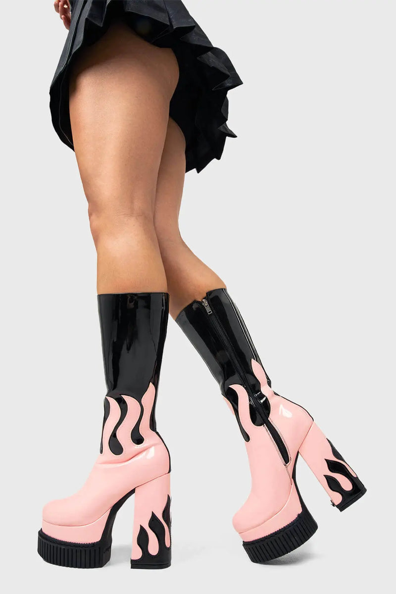 SIZZLING STOMPERS
  
  Ignite Platform Calf Boots in Black Patent. These vegan Platform Boots feature a pink patent flame sole with a black Patent flame on the heel igniting your outfit. Made with eco-friendly materials and 100% cruelty-free, these Boots are as ethical as they are HOT!
  
  - Platform Height: 2 inch
  - Heel Height: 5.5 inch
  - Patent pink flame sole
  - Patent black flame on heel 
  - Platform creeper sole
  - Black Zipper
  - Round toe 
  - 100% vegan 
  
  SKU: LMF 1576 - Black/Pink