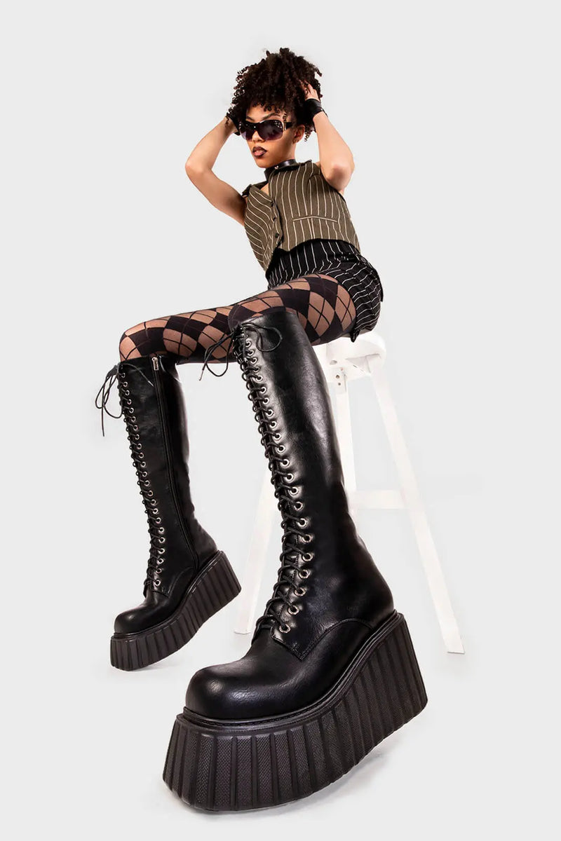 Lace Obsessed
  
  Important Chunky Creeper Platform Knee High Boots in Black faux leather. These black platform boots feature adjustable black lace up detail, turn heads with each step. Made with eco-friendly materials and 100% cruelty-free, these platform boots are as ethical as they are Hot!
  
  - Platform Height
  - Black zipper
  - Blace laces with silver eyelets
  - Chunky platform creeper wedge sole
  - Round Toe 
  - 100% vegan 
  
  SKU: LMF 2217 - BlackPU