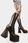Obsessed
  
  Infatuation Platform Calf Boots in Black faux leather. These black vegan Platform Boots feature on our platform sole, walking on platform dreams.Made with eco-friendly materials and 100% cruelty-free, these platform boots are as ethical as they are sexy.
  
  
  - Platform Height: 2.6 inch
  - Heel Height: 5.5 inch
  - Calf High length
  - Black Zipper
  - Platform sole
  - Flared heel
  - Round Toe
  - 100% vegan 
  
  SKU: LMF 1869 - BlackPU