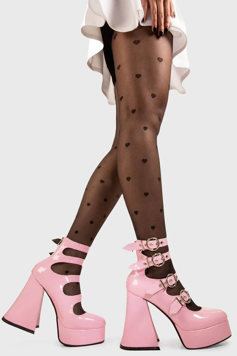 Stellar Stompers
  
  Interstellar Platform Heels in Pink Patent faux leather. These vegan Platform Heels feature four adjustable pink patent ankle straps with ""O"" ring buckles and silver eyelets on a platform sole, stepping into stellar universe. 
  
  - Platform Height: 2.6 inch
  - Heel Height: 5.5 inch
  - Four adjustable pink patent strap
  - Silver eyelets 
  - ""O"" ring buckles
  - Platform sole
  - Flared heel
  - Round toe
  - 100% vegan
  
  SKU: LMF 1704 - PinkPAT