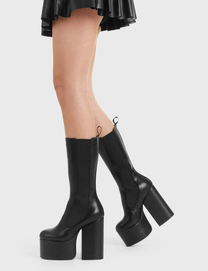 Not Your Basic Boots
  
  Intrusion Platform Calf Boots in Black faux leather. These platform boots feature a minimalist design, with a stetchy gusset and a pull tag, perfect with any outfit. Made with eco-friendly materials and 100% cruelty-free, these platform boots are as ethical as they are Perfect!
  
  - Platform Height
  - Heel Height
  - gusset and pull tag
  - calf length
  - Platform sole
  - High Heel
  - 100% vegan 
  
  SKU: LMF 2850 - BlackPU