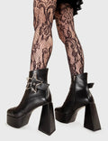 SHINE BRIGHT 
  
  Jailhouse Rock Platform Ankle Boots in Black faux leather. These platform boots feature a silver star buckle with an adjustable strap, keeping it nice and edgy. Made with eco-friendly materials and 100% cruelty-free, these platform boots are as ethical as they are chic.
  
  - Platform Height
  - Silver Star buckles
  - Adjustable straps
  - Lace up
  - Triangle heel
  - High Heel
  - 100% vegan 
  
  SKU: LMF 3333 - BlackPU