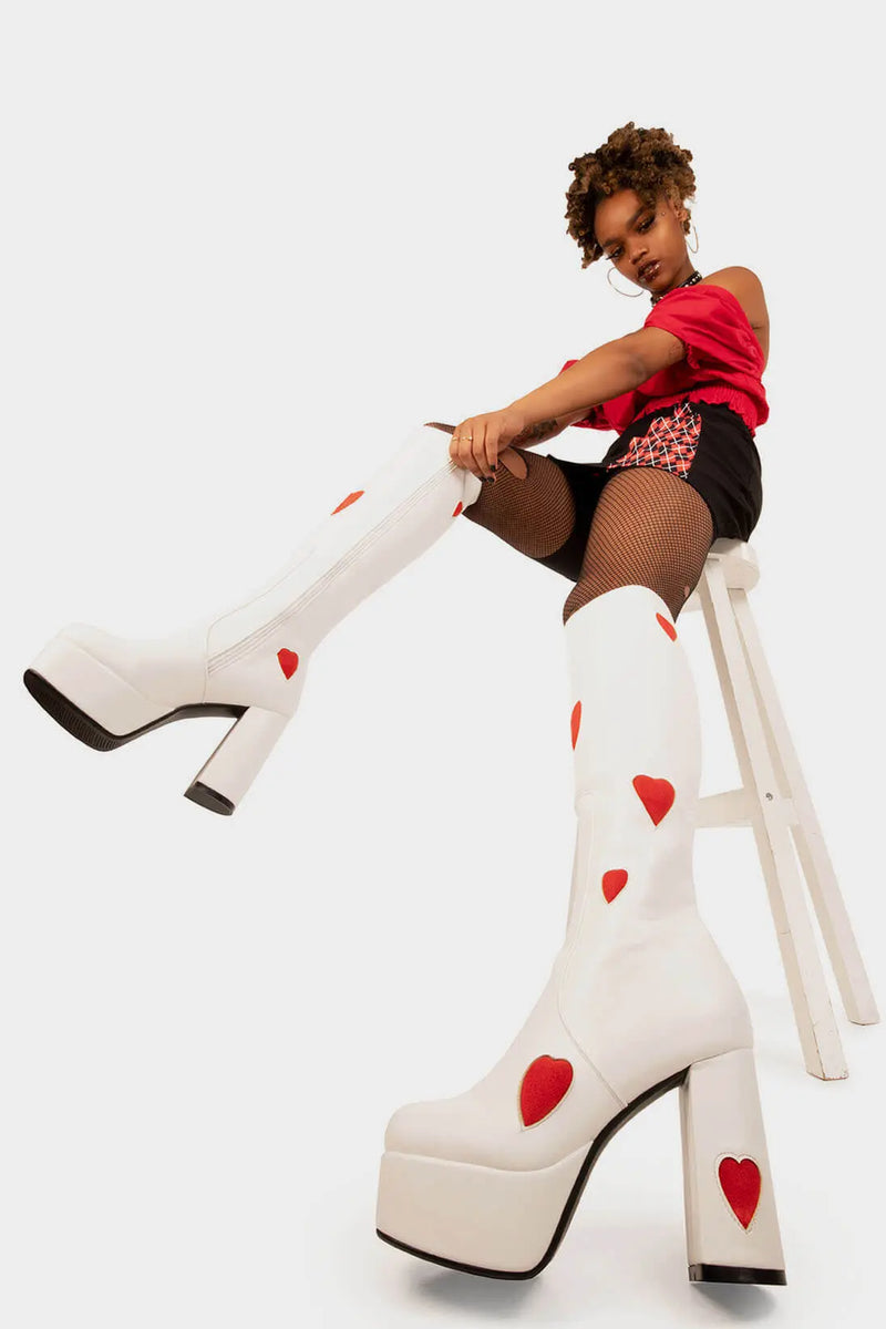 THE ONE FROM INSTA'

Jam Tarts Platform Knee High Boots in White faux leather. These White vegan Boots feature our ICONIC Red faux suede hearts and Platform sole and heel, perfect for adding height and style to any outfit. Made with eco-friendly materials and 100% cruelty-free, these boots are as ethical as they are cute!


- Platform Height: 1.25 inch
- Heel Height: 4.2 inch
- Knee High length
- Red Hearts
- White zipper 
- Platform sole
- Round Toe
- 100% vegan 

SKU: LMF 0916 - White/RedHeart