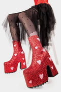 Fairy Dust
  
  Keeper Chunky Platform Ankle Creeper Boot in Red Glitter. These red vegan Platform Boots feature our iconic glitter detail throughout with pink suede hearts, leave a trail of sparkle and make every step a dazzling statment Made with eco-friendly materials and 100% cruelty-free.
  
  
  - Platform Height
  - Heel Height 
  - Red zipper 
  - Pink suede hearts 
  - Chunky Creeper sole
  - Shark's teeth grip
  - Round Toe
  - 100% vegan 
  
  SKU: LMF 2047 - RedGlitter/PinkHeart