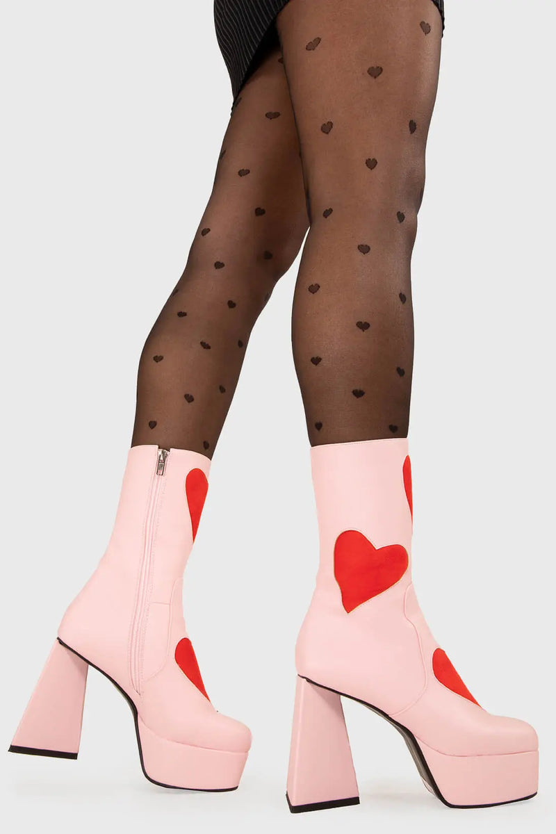LOVEY DOVEY 
  
  Letter To My Lover Platform Ankle Boots in Pink faux leather. These platform boots feature a pink boot with big red heart all over. Made with eco-friendly materials and 100% cruelty-free, these platform boots are as ethical as they are chic.
  
  - Platform Height
  - Big red hearts
  - Calf length
  - Triangle heel
  - High Heel
  - 100% vegan 
  
  SKU: LMF 3337 - PinkPU/RedHeart