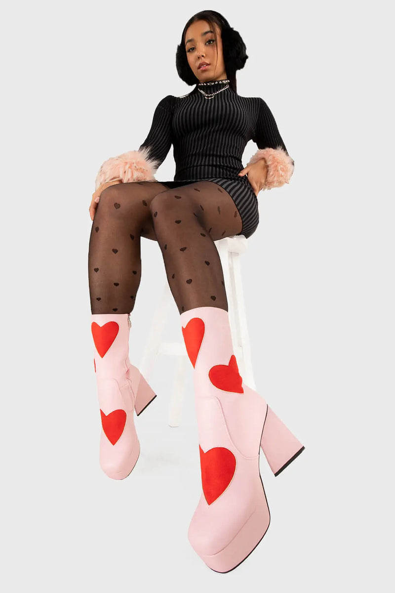 LOVEY DOVEY 
  
  Letter To My Lover Platform Ankle Boots in Pink faux leather. These platform boots feature a pink boot with big red heart all over. Made with eco-friendly materials and 100% cruelty-free, these platform boots are as ethical as they are chic.
  
  - Platform Height
  - Big red hearts
  - Calf length
  - Triangle heel
  - High Heel
  - 100% vegan 
  
  SKU: LMF 3337 - PinkPU/RedHeart