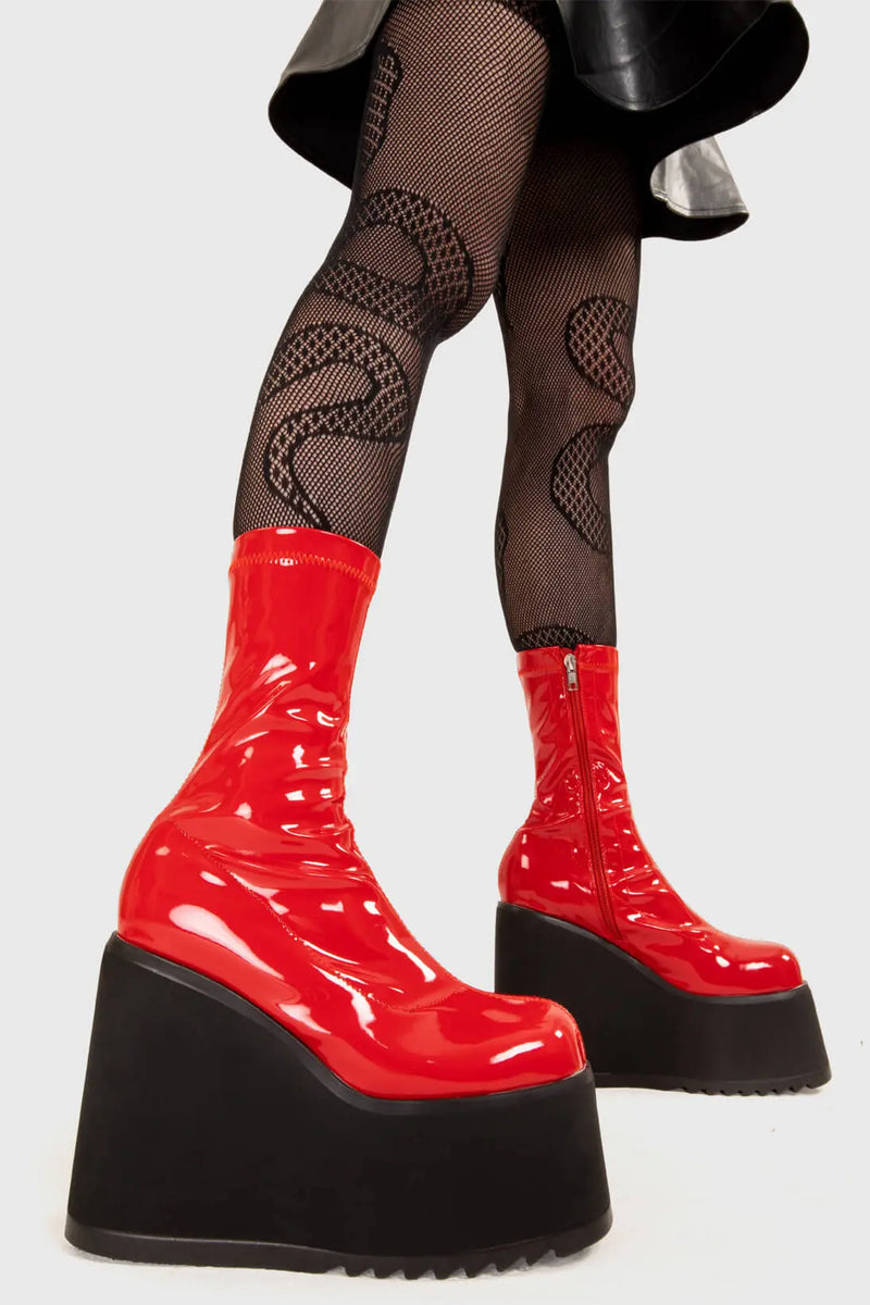 Platform Staples
  
  Lights Out Chunky Platform Ankle Boots in Red Patent faux leather. These red platform boots feature on our chunky platform wedge sole, step up your shoes game! Made with eco-friendly materials and 100% cruelty-free, these platform boots are as ethical as they are Fashion Staples!
  
  - Platform Height
  - Red Zip
  - Chunky Platform wege sole
  - Shark's teeth rubber grip
  - Round Toe 
  - 100% vegan 
  
  SKU: LMF 2369 - RedPAT