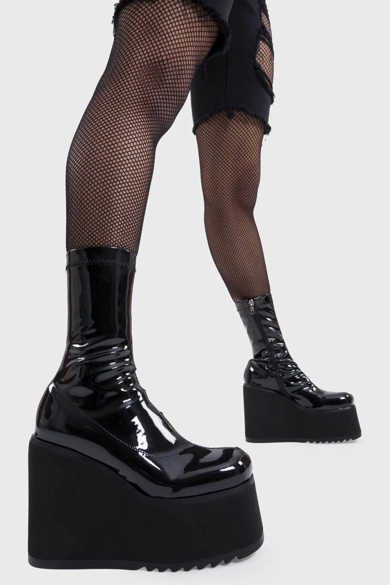 Platform Staples
  
  Lights Out Chunky Platform Ankle Boots in Black Patent faux leather. These black platform boots feature on our chunky platform wedge sole, step up your shoes game! Made with eco-friendly materials and 100% cruelty-free, these platform boots are as ethical as they are Fashion Staples!
  
  - Platform Height
  - Black Zip
  - Chunky Platform wege sole
  - Shark's teeth rubber grip
  - Round Toe 
  - 100% vegan 
  
  SKU: LMF 2369 - BlackPAT