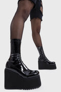 Platform Staples
  
  Lights Out Chunky Platform Ankle Boots in Black Patent faux leather. These black platform boots feature on our chunky platform wedge sole, step up your shoes game! Made with eco-friendly materials and 100% cruelty-free, these platform boots are as ethical as they are Fashion Staples!
  
  - Platform Height
  - Black Zip
  - Chunky Platform wege sole
  - Shark's teeth rubber grip
  - Round Toe 
  - 100% vegan 
  
  SKU: LMF 2369 - BlackPAT