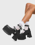 CUTIE PIE Look Away Chunky Platform Shoes in Black faux leather. These vegan western Boots feature a minimalist design with two adjustable straps, very chic. Made with eco-friendly materials and 100% cruelty-free, these boots are as ethical as they are cute! - Platformed - Ankle length - Two adjustable straps - Silver square buckles - Chunky platform sole - Rounded toe - 100% vegan SKU: LMF 3928 - BlackPU