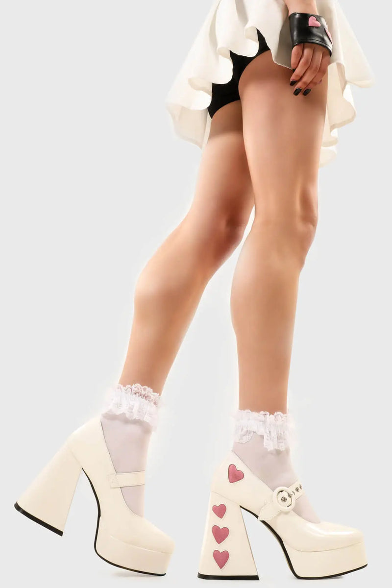 Cupid is here 
  
  Love Sick Platform Heels in Black Patent faux leather. These vegan Platform Heels feature pink patent hearts on the heel and side of the shoe with a adjustable black strap, Heels that speak the language of love. 
  
  - Platform Height: 2.6 inch
  - Heel Height: 5.5 inch
  - Ajustable strap 
  - "O" ring shaped buckles and silver eyelets
  - Pink Patent hearts 
  - Platform sole
  - Flared heel
  - Round toe 
  - 100% vegan
  
  SKU: LMF 1709 - WhitePAT/PinkHeart