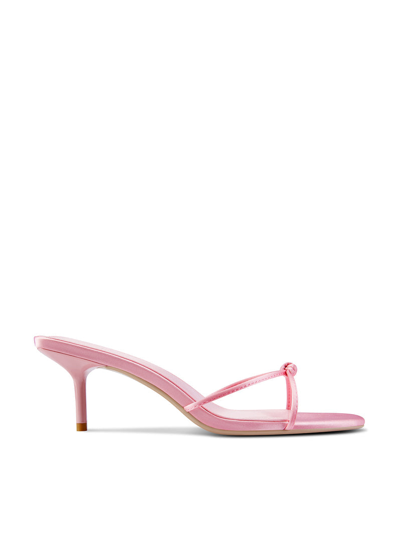 Femme LA Maeve Slipper in Baby Pink – side profile of baby pink satin mule with thin toe strap, knot detail, and slim kitten heel