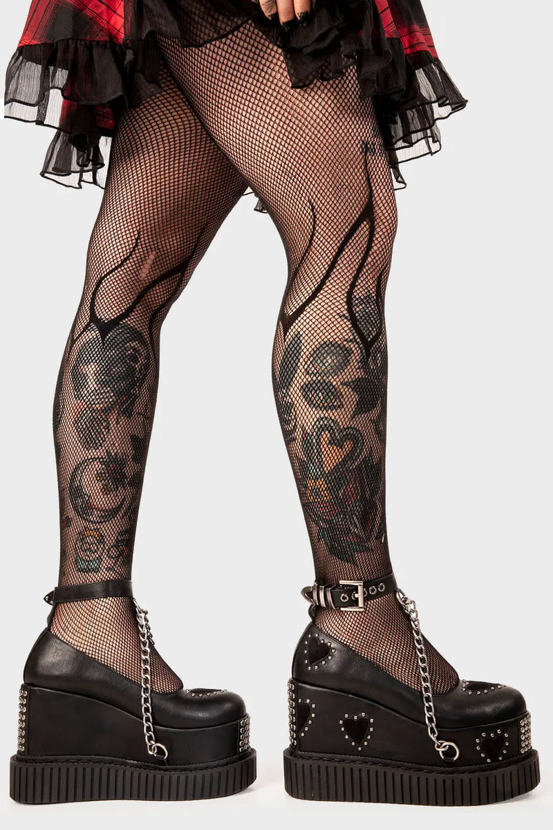 Royal Elegance
 
 Majesty Chunky Platform Creeper shoes in black faux leather. These black vegan Platform shoes feature black suede hearts throughout with a perimeter of silver studs and a black ankle strap featuring a silver hanging chain, reach new heights of style and authority.
 
 
 - Platform Height
 - Heel Height 
 - Sqaure buckles 
 - Silver studs
 - Black suede hearts
 - Silver chain 
 - Black strap with silver eyelets
 - Chunky creeper sole
 - Round Toe
 - 100% vegan 
 
 SKU: LMF 2116 - Black/Heart