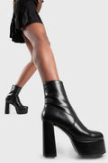 Diva's Delight.
  
  Making Moves Platform Ankle Boots in black faux leather. These vegan Platform Ankle boots feature a platform sole to reach new heights in the style game. Made with eco-friendly materials and 100% cruelty-free, these Boots are as ethical as they are delightful!
  
  - Platform Height: 1.25 inch
  - Heel Height: 4.2 inch 
  - Black Zipper
  - High Platform sole
  - Round toe
  - 100% vegan
  
  SKU: LMF 1559 - BlackPU