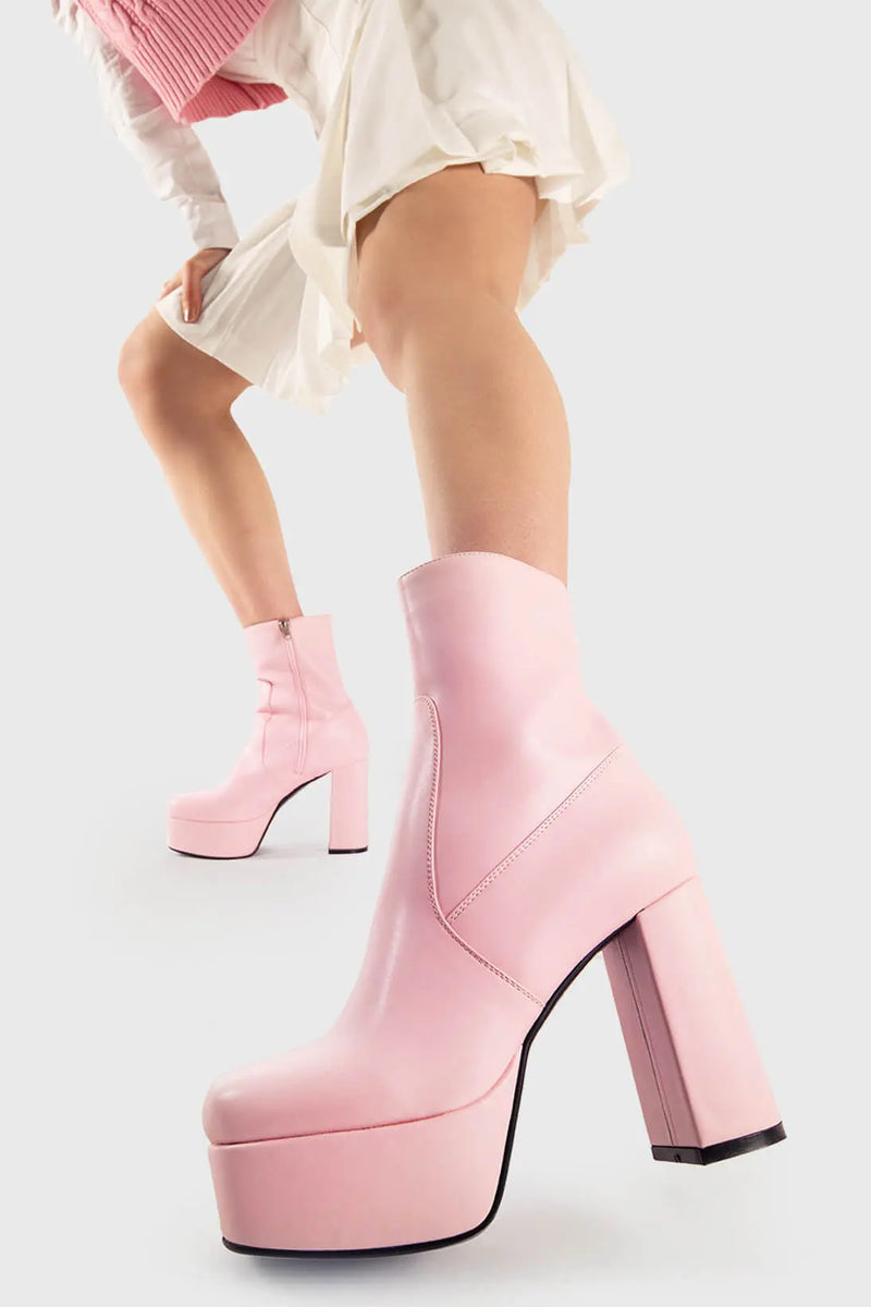 Diva's Delight.
  
  Making Moves Platform Ankle Boots in pink faux leather. These vegan Platform Ankle boots feature a platform sole to reach new heights in the style game. Made with eco-friendly materials and 100% cruelty-free, these Boots are as ethical as they are delightful!
  
  - Platform Height: 1.25 inch
  - Heel Height: 4.2 inch
  - Pink Zipper
  - High Platform sole
  - Round toe
  - 100% vegan
  
  SKU: LMF 1559 - PinkPU