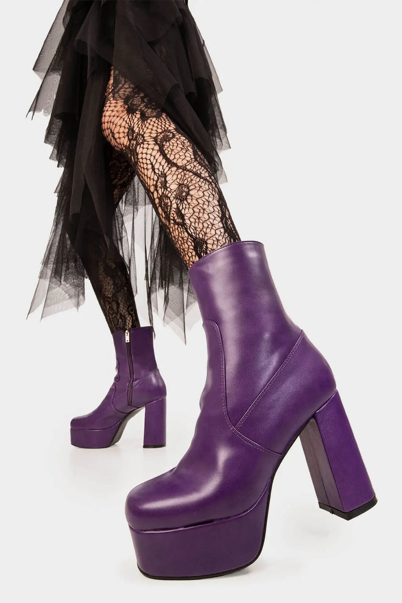 Diva's Delight.
  
  Making Moves Platform Ankle Boots in Purple faux leather. These vegan Platform Ankle boots feature a platform sole to reach new heights in the style game. Made with eco-friendly materials and 100% cruelty-free, these Boots are as ethical as they are delightful!
  
  - Platform Height: 1.25 inch
  - Heel Height: 4.2 inch
  - Purple Zipper
  - High Platform sole
  - Round toe
  - 100% vegan
  
  SKU: LMF 1559 - PurplePU