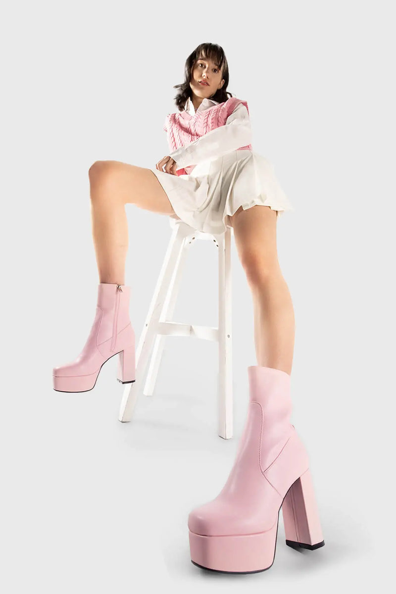 Diva's Delight.
  
  Making Moves Platform Ankle Boots in pink faux leather. These vegan Platform Ankle boots feature a platform sole to reach new heights in the style game. Made with eco-friendly materials and 100% cruelty-free, these Boots are as ethical as they are delightful!
  
  - Platform Height: 1.25 inch
  - Heel Height: 4.2 inch
  - Pink Zipper
  - High Platform sole
  - Round toe
  - 100% vegan
  
  SKU: LMF 1559 - PinkPU
