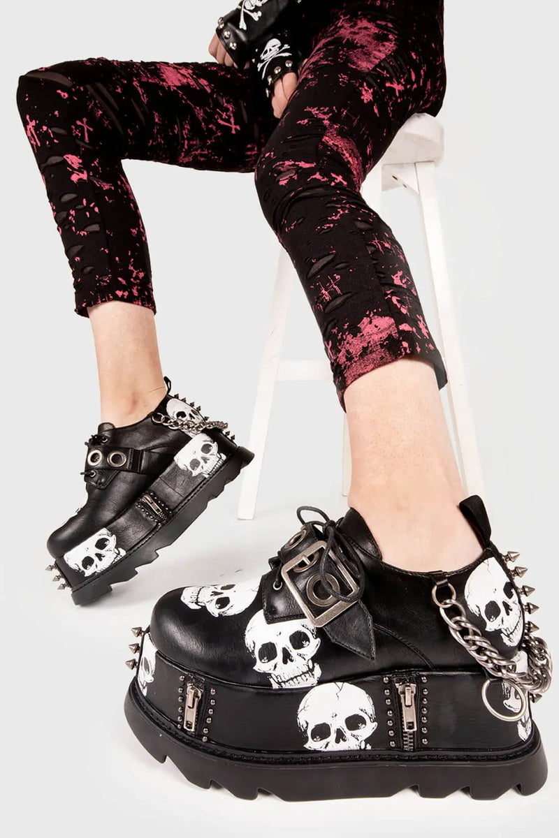 Rebel Soles.

Maniac Chunky Platform Wedge Shoes in Black faux leather. These Black vegan platform shoes feature our ICONIC Skull print on a chunky platform sole , leaving a mark and making a statment. Made with eco-friendly materials and 100% cruelty-free, these boots are as ethical as they are badass!


- Platform Height: 3.2 inch
- Adjustable strap with silver eyelets
- Black laces 
- Skull print
- Silver spikes
- Silver Chain
- Platform wedge sole
- Round Toe
- 100% vegan 

SKU: LMF 1541 - BlackPU/Skull