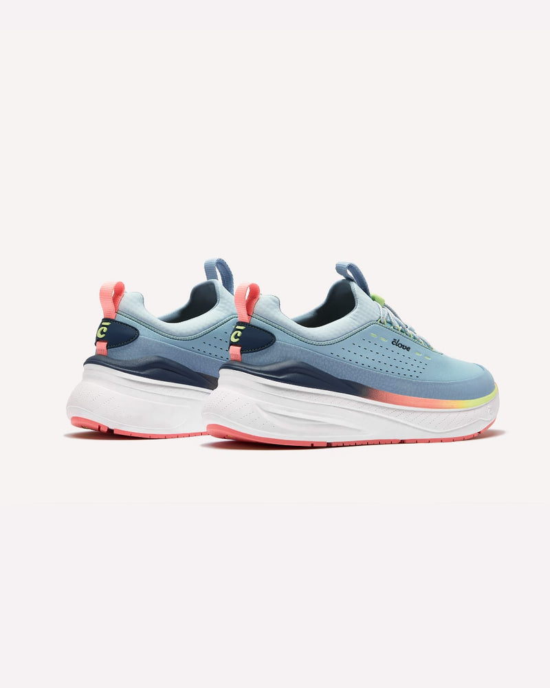 Pair of blue running shoes with colorful accents on a white background