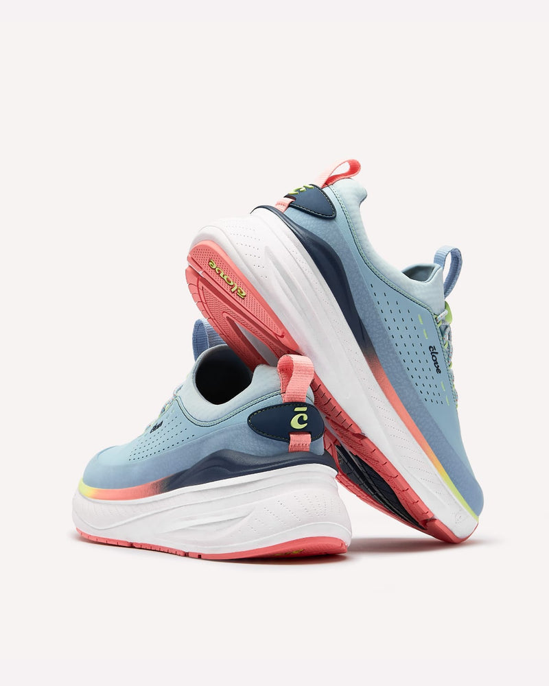 Pair of light blue and pink running shoes on a white background