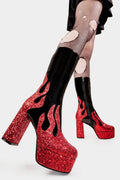 Flame Fury
  
  Miami Platform Calf Boots Boot in Patent Black faux leather. These black vegan Platform Boots feature red glitter flame detail up the sole, flames of style to ingnite your presencel! Made with eco-friendly materials and 100% cruelty-free, these platform boots are as ethical as they are HOT!
  
  
  - Platform Height: 2.6 inch
  - Heel Height: 5.5 inch
  - Black zip
  - Platform Sole 
  - Round Toe
  - 100% vegan 
  
  SKU: LMF 2039 - BlackPAT/RedGlitter