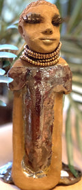 Meet Morgan! Morgan stands 9' x 4"x 3.5" and weighs 1 lbs. She has bright honey brown complexion. Her dress is a s Morgan wears an amber beaded necklace Her long trademark arms rest at her side. Morgan is waiting for a new home!