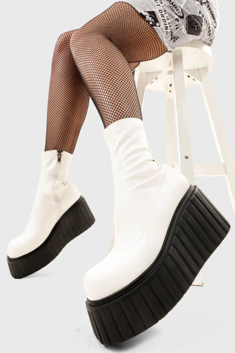 Choas Crushers
  
  Muster Up Chunky Ankle Creeper Boots in White faux leather. These platform boots feature on our creeper sole, crush the limits and break the ordinary. Made with eco-friendly materials and 100% cruelty-free, these platform boots are as ethical as they are Iconic.
  
  - Platform Height
  - Black zipper
  - Mid ankle length
  - Platform sole
  - Round Toe 
  - 100% vegan 
  
  SKU: LMF 2660 - WhitePU