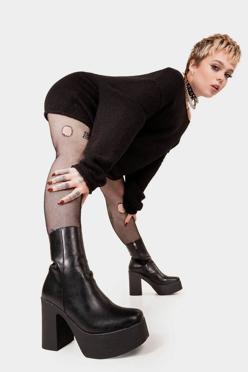 THE TRENDING ONE
  
  My Hero Platform Ankle Boots in Black faux leather. These Black vegan Ankle Boots feature an elegant clutter free design and a Platform sole and heel, perfect for adding height and style to any outfit. Made with eco-friendly materials and 100% cruelty-free, these boots are as ethical as they are stylish.
  
  
  - Platform Height: 1.25 inch
  - Heel Height: 4 inch
  - Low ankle length
  - Black zipper 
  - Platform sole
  - Square toe 
  - 100% vegan 
  
  SKU: LMF 1211 - BlackPU