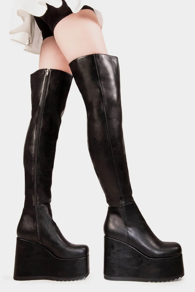 Peak Perfection
  
  Never Again Chunky Platform Thigh High Boot in Black faux leather. These black vegan Platform Boots feature on our chunky platform wedge sole, let the boots do the talking. Made with eco-friendly materials and 100% cruelty-free, these platform boots are as ethical as they are Perfect!
  
  
  - Platform Height
  - Black Zipper
  - Chunky Platform wedge sole
  - Shark's teeth grip
  - Round Toe
  - 100% vegan 
  
  SKU: LMF 2069 - BlackPU