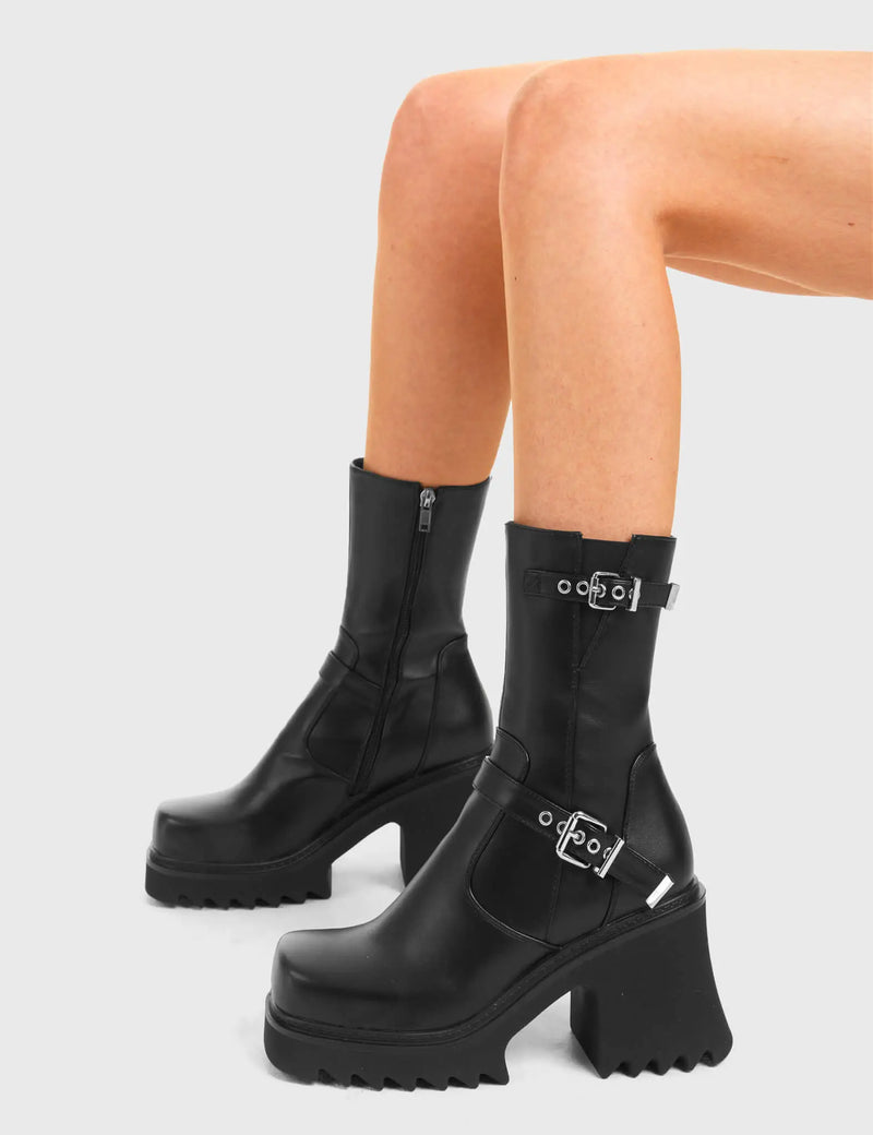 BUCKLED UP 
  
  New Mission Chunky Platform Ankle Boots in Black Faux Leather. These vegan western Boots feature Two silver square buckles and a shark teeth grip sole, very edgy. Made with eco-friendly materials and 100% cruelty-free, these boots are as ethical as they are Chic!
  
  
  - Chunky Platform
  - Calf length
  - Shark teeth grip
  - Two silver buckles
  - Adjustable straps
  - Rounded toe 
  - 100% vegan 
  
  SKU: LMF 3733 - BlackPU